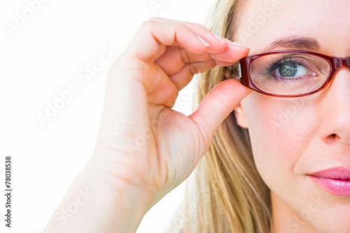 Fotografía Close up of pretty blonde with red reading glasses