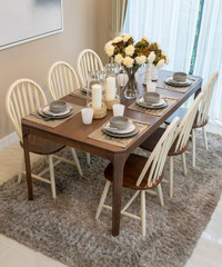 dining table and comfortable chairs in modern home with elegant