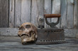 Human skull on the floor with old wood stove old,Still Life