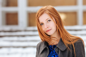 Closeup portrait of young beautiful redhead woman