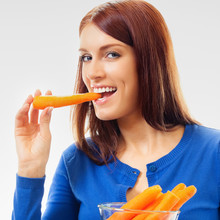 Young Happy Woman Eating Carrots