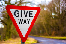 Give Way Uk Road Sign With Blurred Background