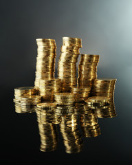 Wall Mural - Pile of coins on dark background