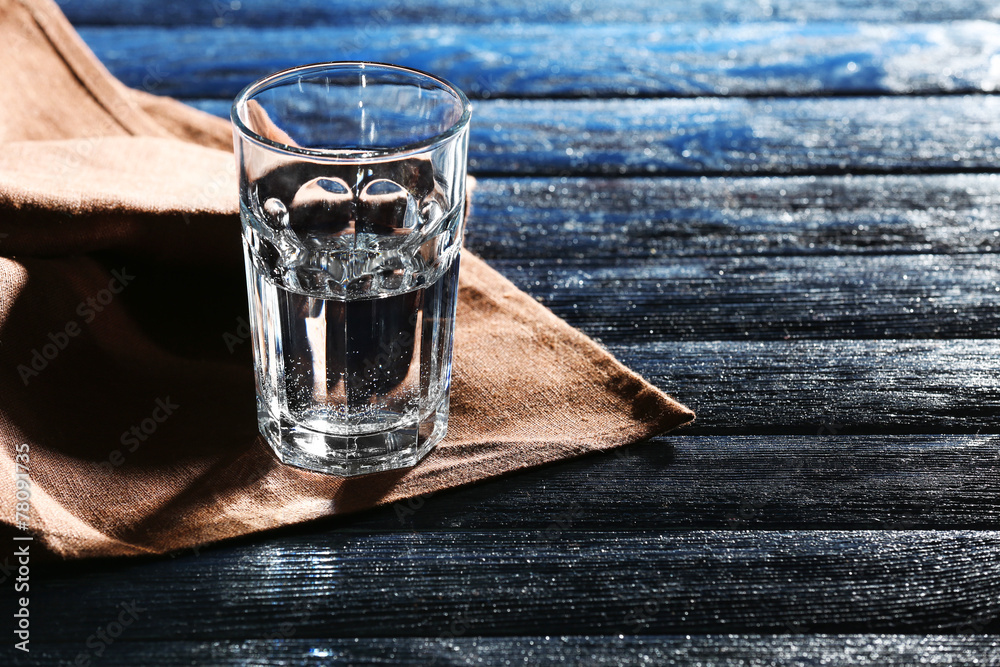 Glass of water on napkin close up