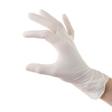 Doctor Hand In Sterile Gloves Isolated On White