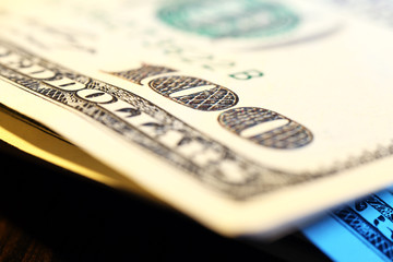 Wall Mural - Stack of hundred dollars on wooden table, macro view