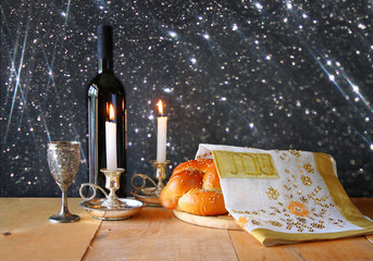 Wall Mural - shabbat image. challah bread, shabbat wine and candelas on woode