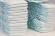 Two stacks of disposable baby diapers