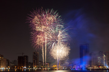 Fototapete - Fireworks display in Sharjah City, United Arab Emirates