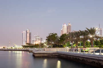 Wall Mural - Corniche in Abu Dhabi illuminated at dusk, UAE