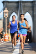 New York runners running on Brooklyn bridge NYC
