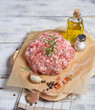 Raw minced meat with pepper, garlic, olive oil and salt
