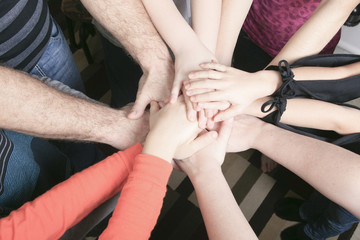 Wall Mural - Many hands together inside family house