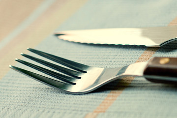 Cutlery. Fork with a knife on a napkin.