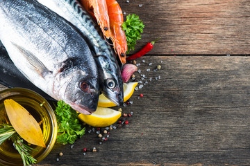 Fresh whole sea fish with aromatic herbs and spices