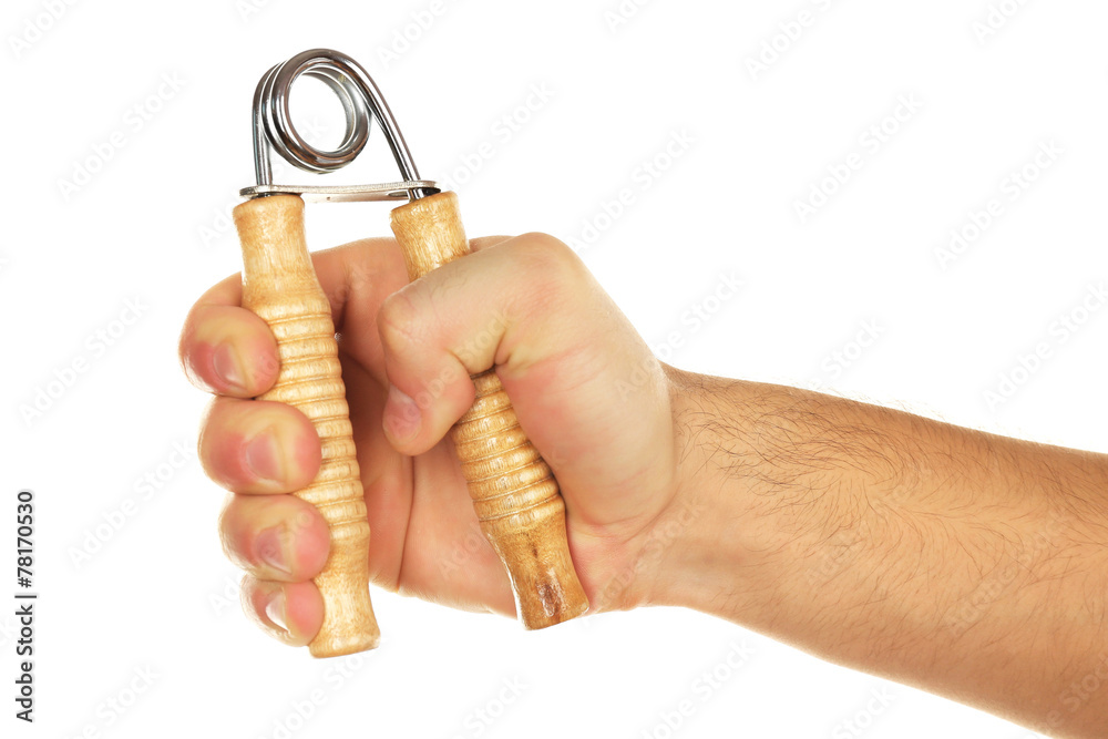 Hand trainer with steel spring in male hand, isolated on white