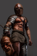 Wounded gladiator with muscular body in armour