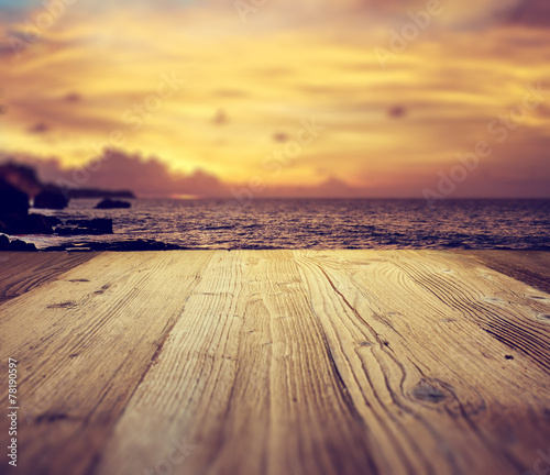 wooden table background on the tropical beach