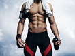 © SFIO CRACHO - Strong athletic man on blue sky background