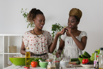 Wall Mural - Two Young African Women Cooking