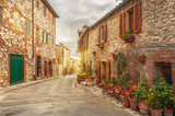 Fototapeta Uliczki - Old italian colorful town in Tuscany