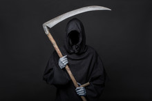 Death Reaper Over Black Background. Halloween