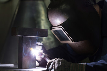 professional welder welding metal parts