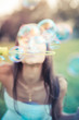 © Eugenio Marongiu - beautiful young woman with white dress blowing bubble