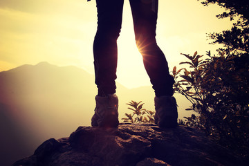 hiking legs sunrise mountain peak