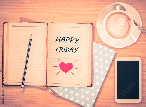 Poster Happy Friday on notebook , pencil, smart phone and coffee cup wi