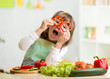 © Oksana Kuzmina - kid girl having fun with food vegetables