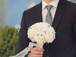 White Bouquet in Groom's Hand