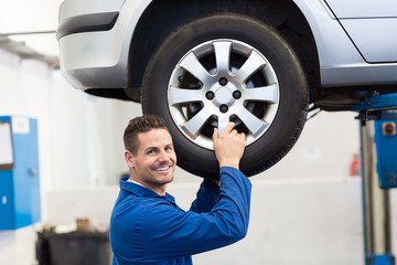 Mechanic adjusting the tire wheel