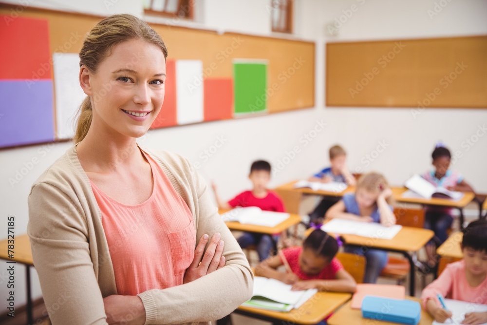 Pretty teacher smiling at camera at top of classroom Stock Photo ...