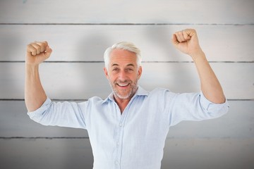 Poster - Composite image of smiling man cheering at camera