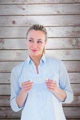 Poster - Composite image of beautiful blonde smiling and holding