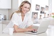 © WavebreakmediaMicro - Composite image of happy woman using laptop at counter