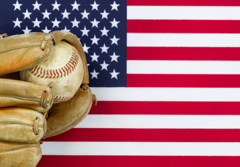 Wall Mural - Worn baseball glove and ball on American Flag