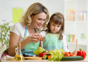 Wall Mural - mother with kid make salad