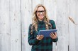 © WavebreakMediaMicro - Pretty blonde with glasses using tablet