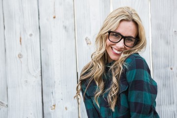 Wall Mural - Happy blonde posing with glasses looking at camera