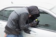© WavebreakmediaMicro - Thief breaking into car with screwdriver