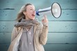 © WavebreakMediaMicro - Composite image of pretty blonde with megaphone