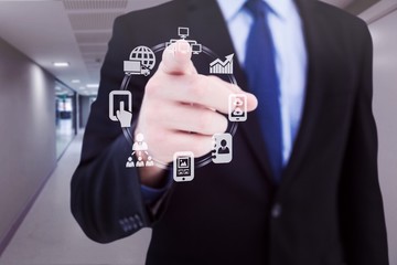 Poster - Composite image of businessman pointing his finger at camera