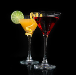 Wall Mural - Two cocktails red cosmopolitan cocktail on a black background