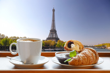 Wall Mural - Coffee with croissants against Eiffel Tower in Paris, France