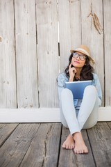 Poster - Pretty hipster sitting on ground with tablet