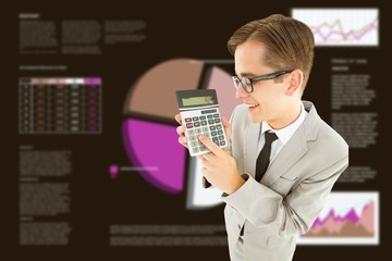 Poster - Composite image of geeky smiling businessman showing calculator