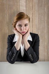 Poster - Composite image of redhead businesswoman looking unhappy