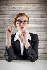 Poster - Composite image of thinking redhead businesswoman
